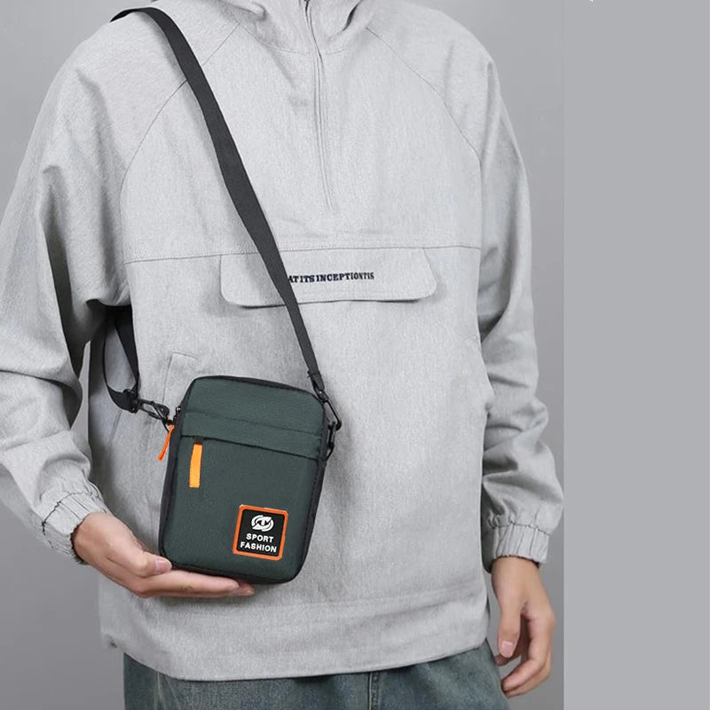 Men's single-shoulder cross-body bag with multi-layer zippers, trendy color contrast, and casual messenger style bag