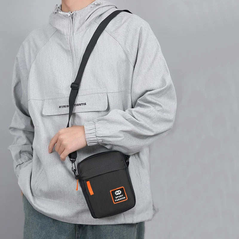 Men's single-shoulder cross-body bag with multi-layer zippers, trendy color contrast, and casual messenger style bag