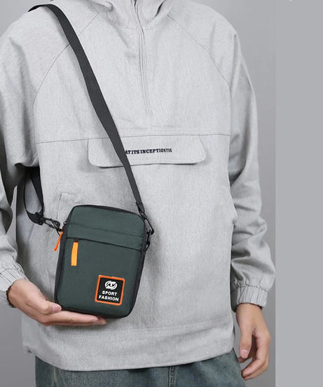 Men's single-shoulder cross-body bag with multi-layer zippers, trendy color contrast, and casual messenger style bag