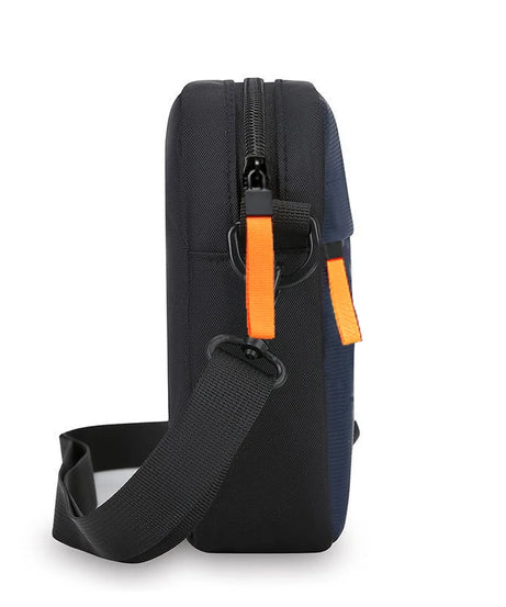 Men's single-shoulder cross-body bag with multi-layer zippers, trendy color contrast, and casual messenger style bag